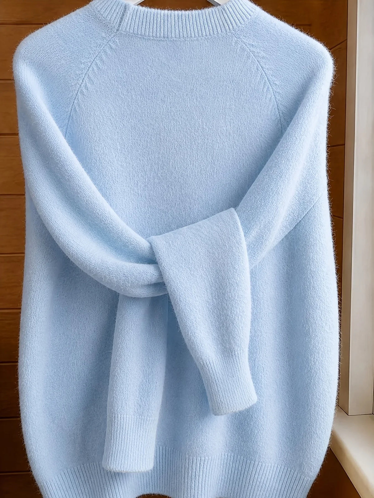 Women's light blue crew-neck knit sweater