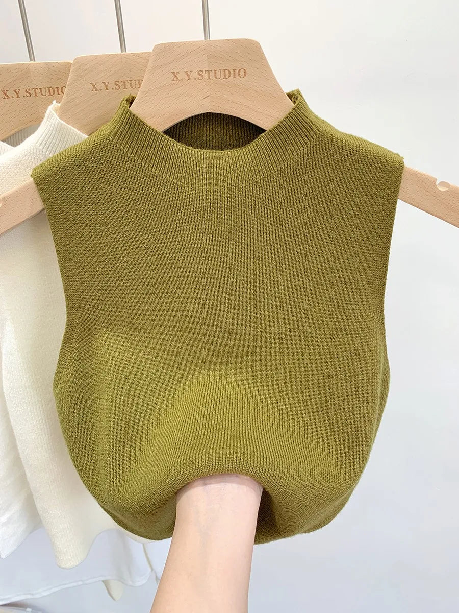 Ribbed knitted sleeveless top with stand collar