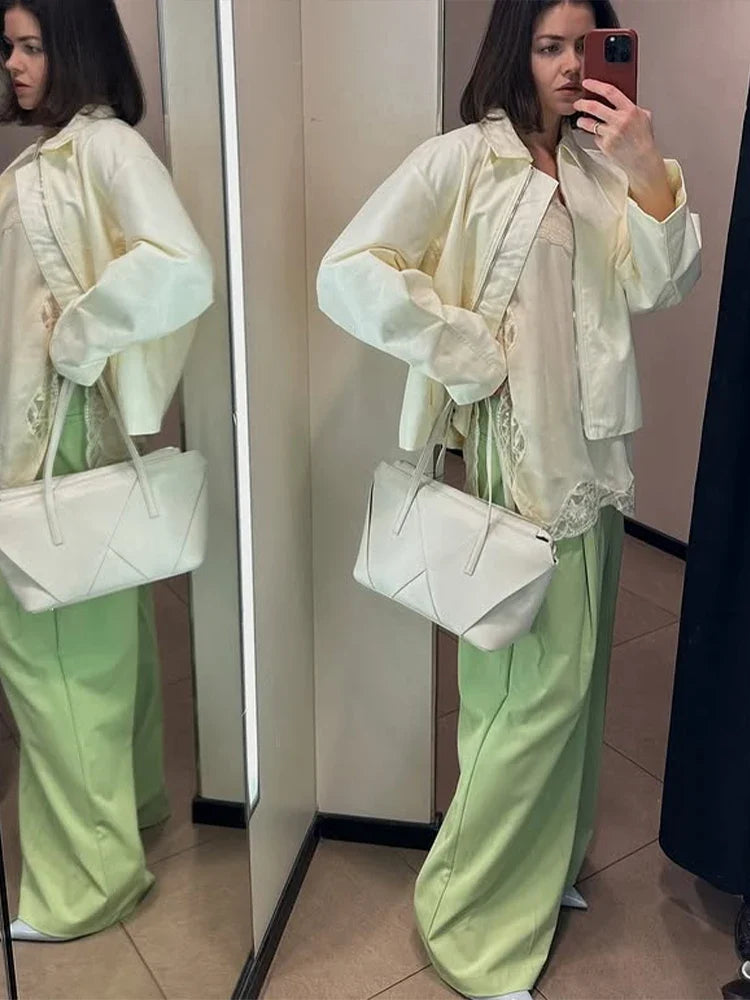 Women's cream-colored jacket with zipper, collar, and wide sleeves