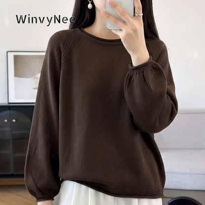 Women's crew-neck long-sleeve knit sweater with raglan sleeves and cuffs