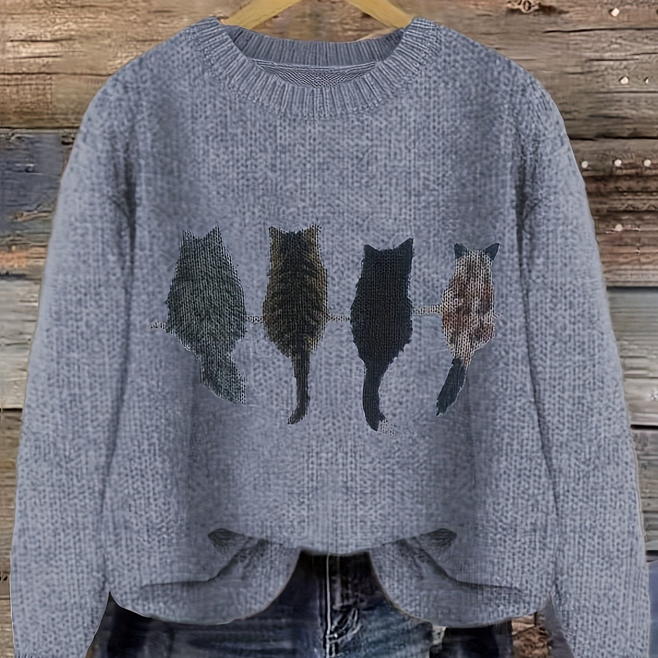 Women's knitted sweater with round neckline and cat motif