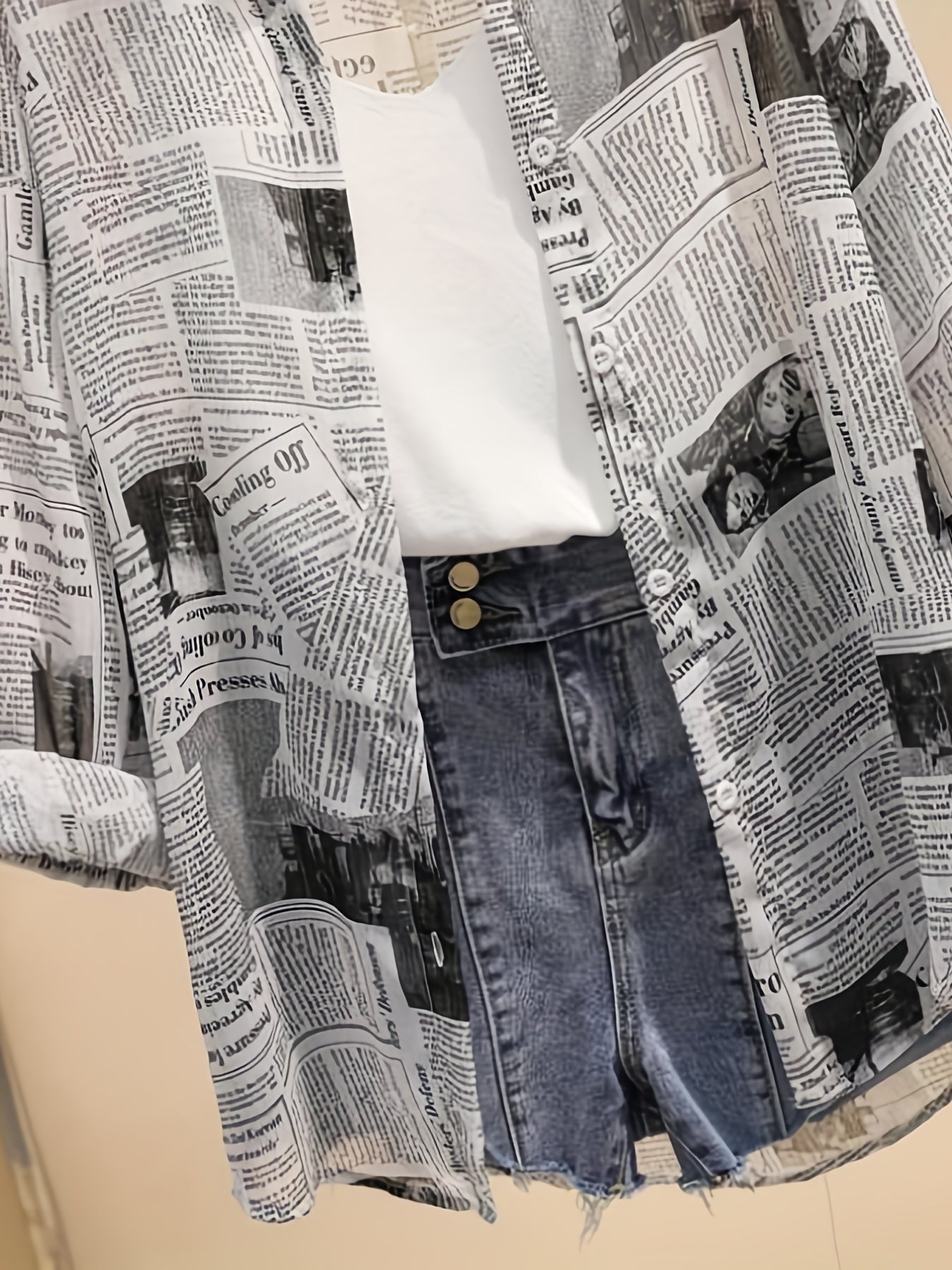 Women's blouse with newspaper print and shorts – fashionable set for leisure and everyday wear