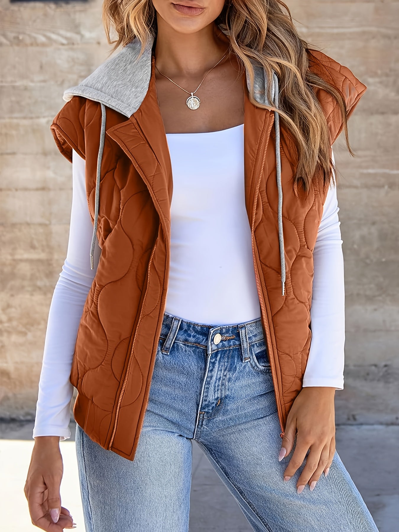 Women's quilted vest with hood in rust brown