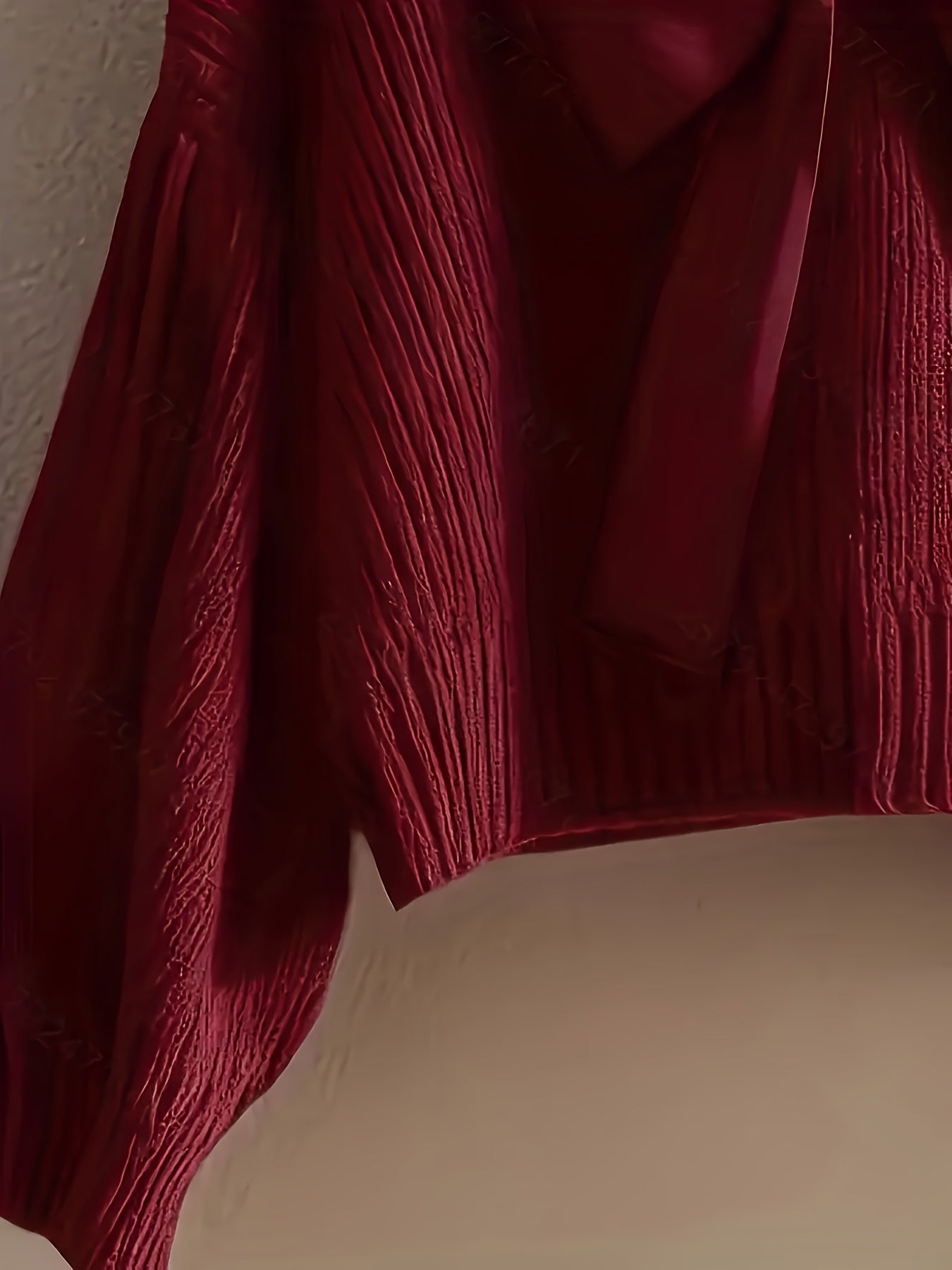 Women's ribbed long-sleeve V-neck sweater with a large bow