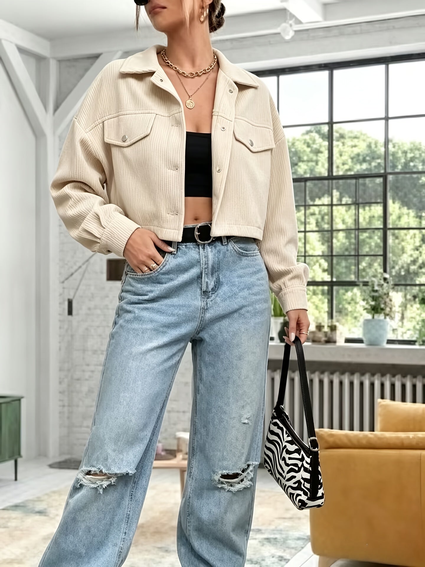 Short women's corduroy jacket with a collar and chest pockets