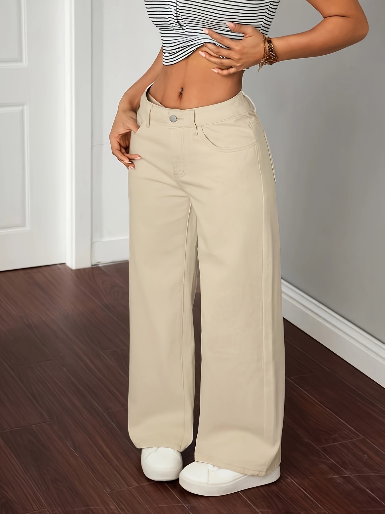 Women's wide-leg beige trousers with a straight leg and high waist