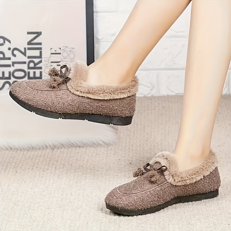 Women's black plush slippers with a bow