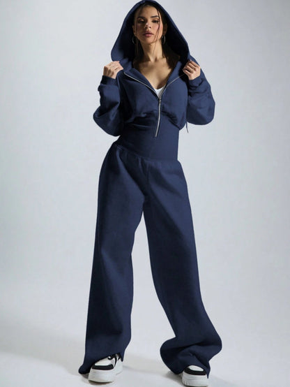 Women's jumpsuit with hood, long sleeves, wide legs, and zipper