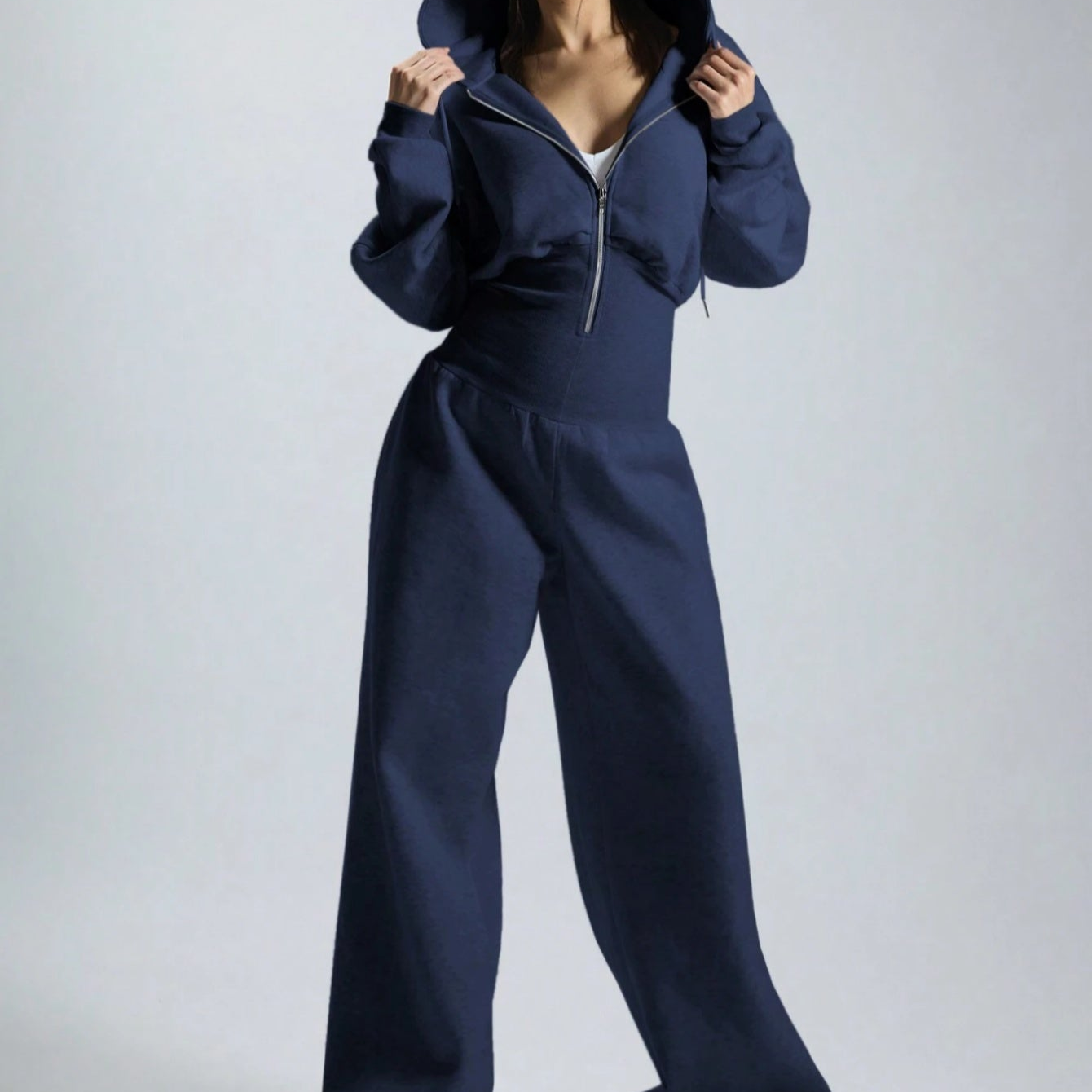 Women's jumpsuit with hood, long sleeves, wide legs, and zipper