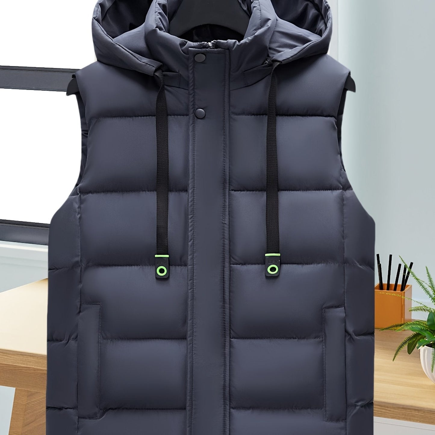 Unisex hooded quilted vest with a zipper and pockets