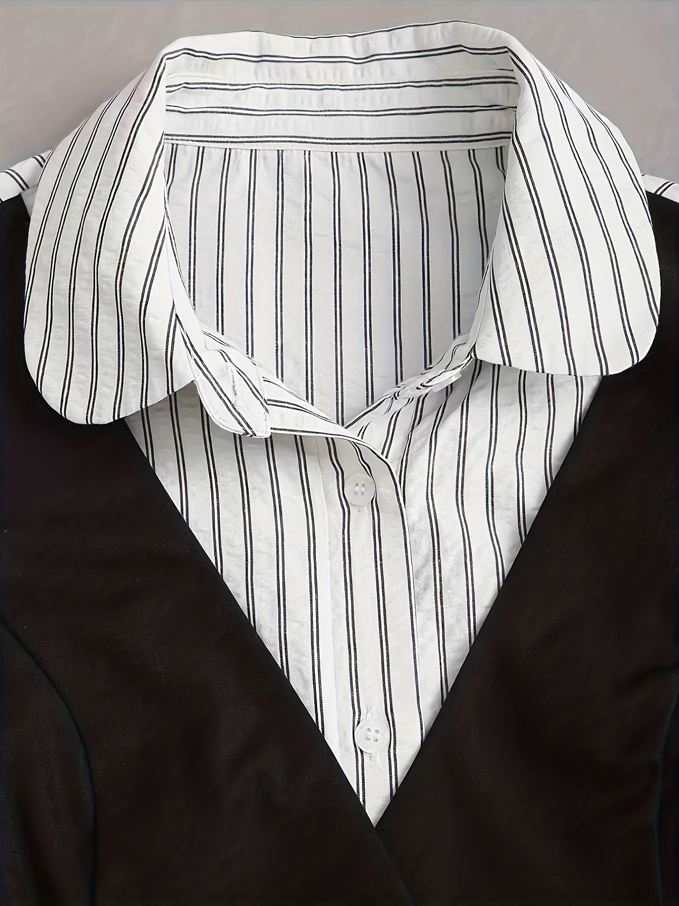 Women's striped black-and-white blouse and vest set