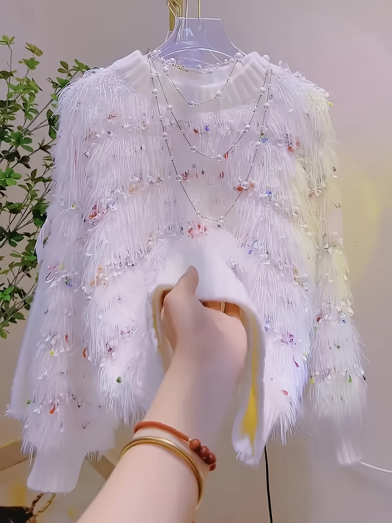 White fluffy pullover with colorful accents