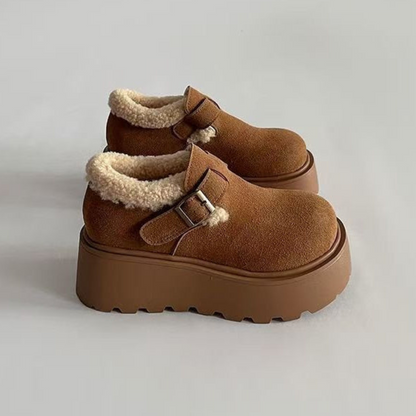 Brown platform moccasins with fur lining and buckle