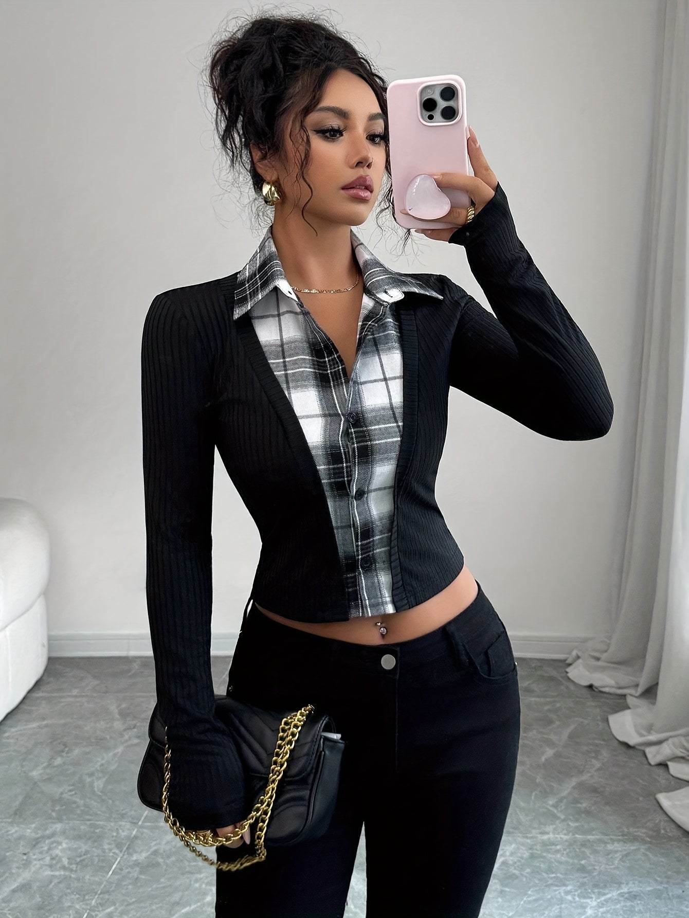 Women's black long-sleeve top with a checked blouse look