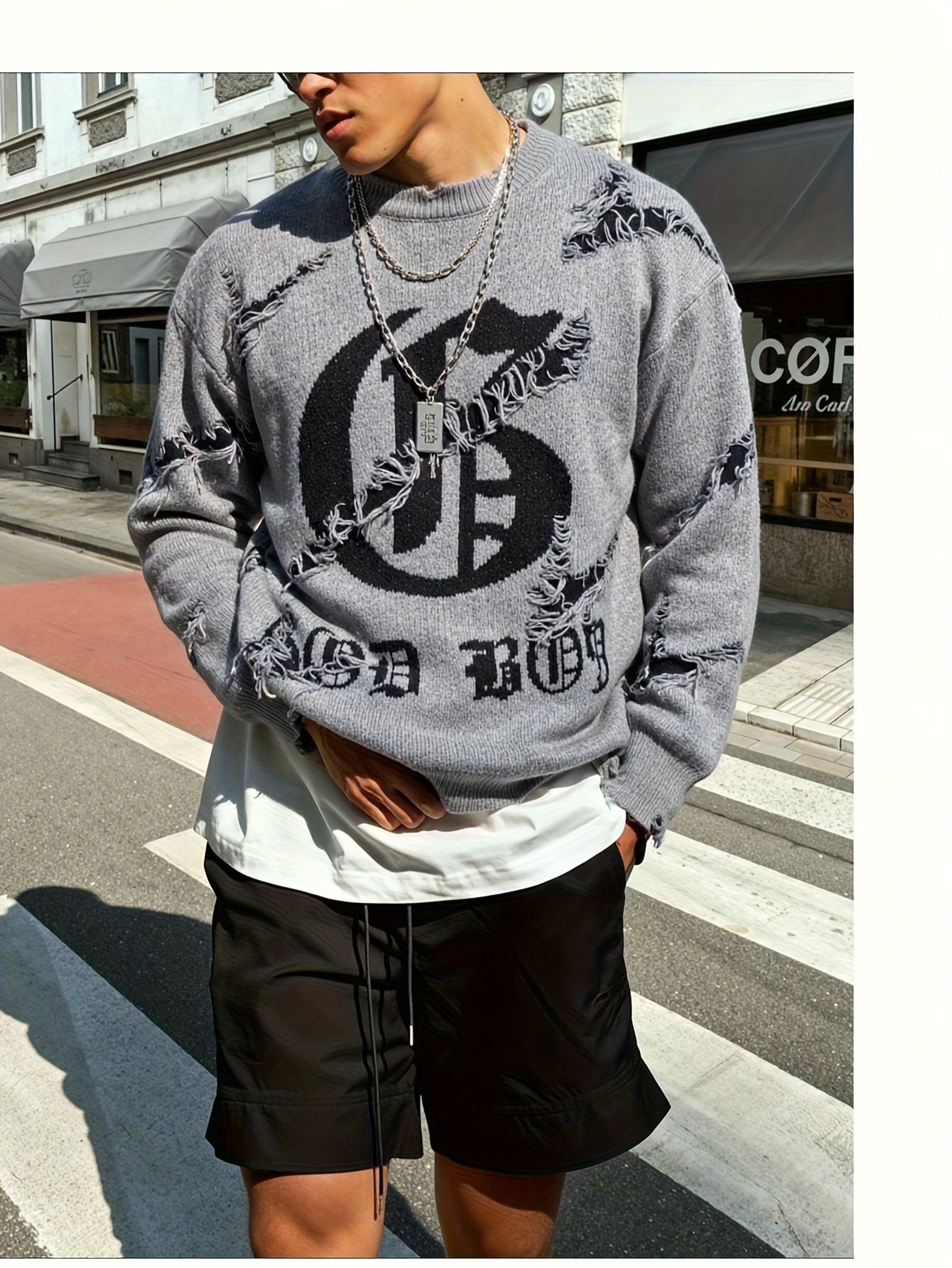 Unisex distressed pullover with a crew neck and statement print