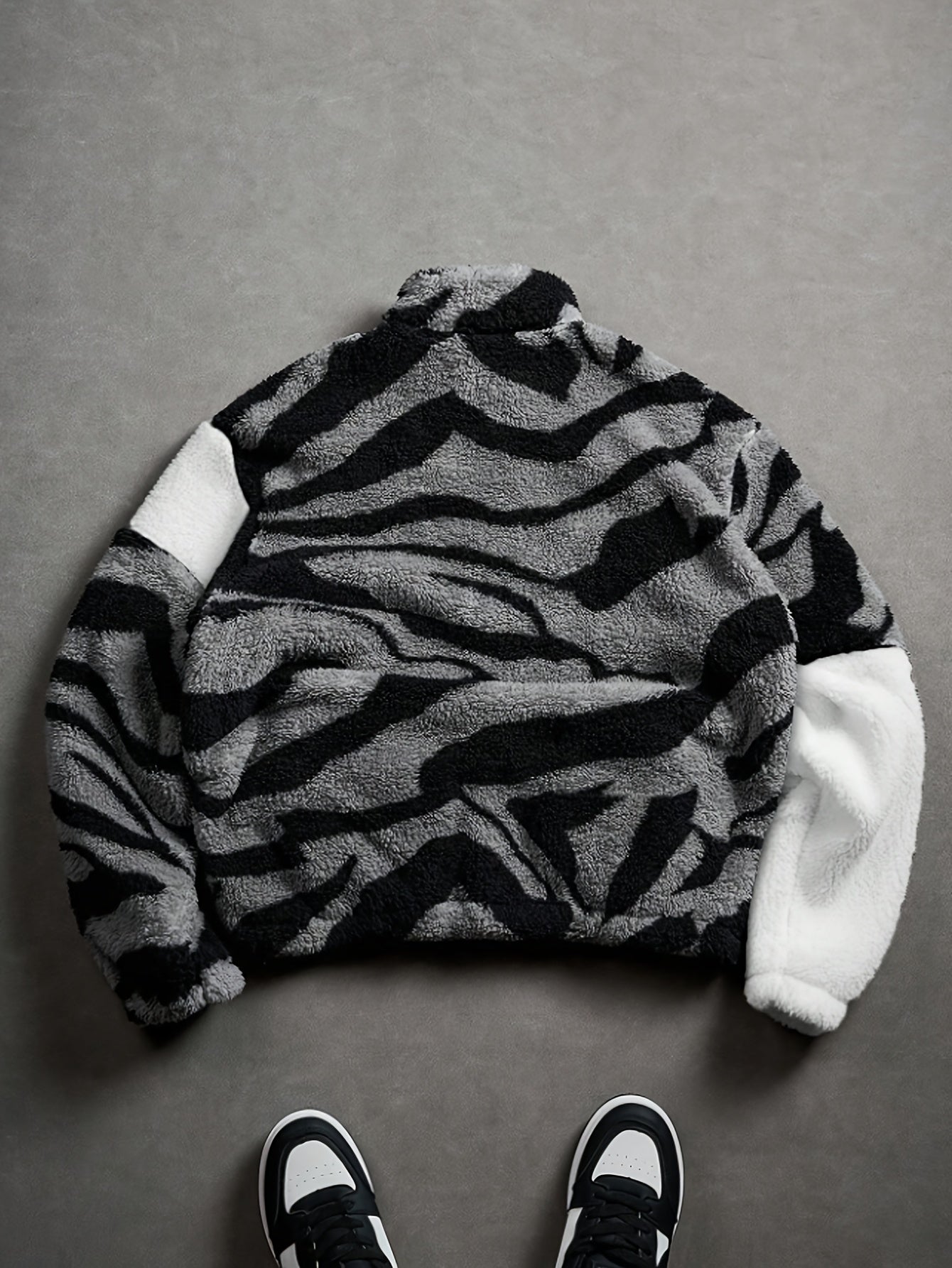 Unisex fleece jacket with stand-up collar, zipper, and animal print