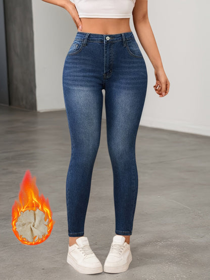 Women's lined slim-fit jeans in dark blue with warm inner lining