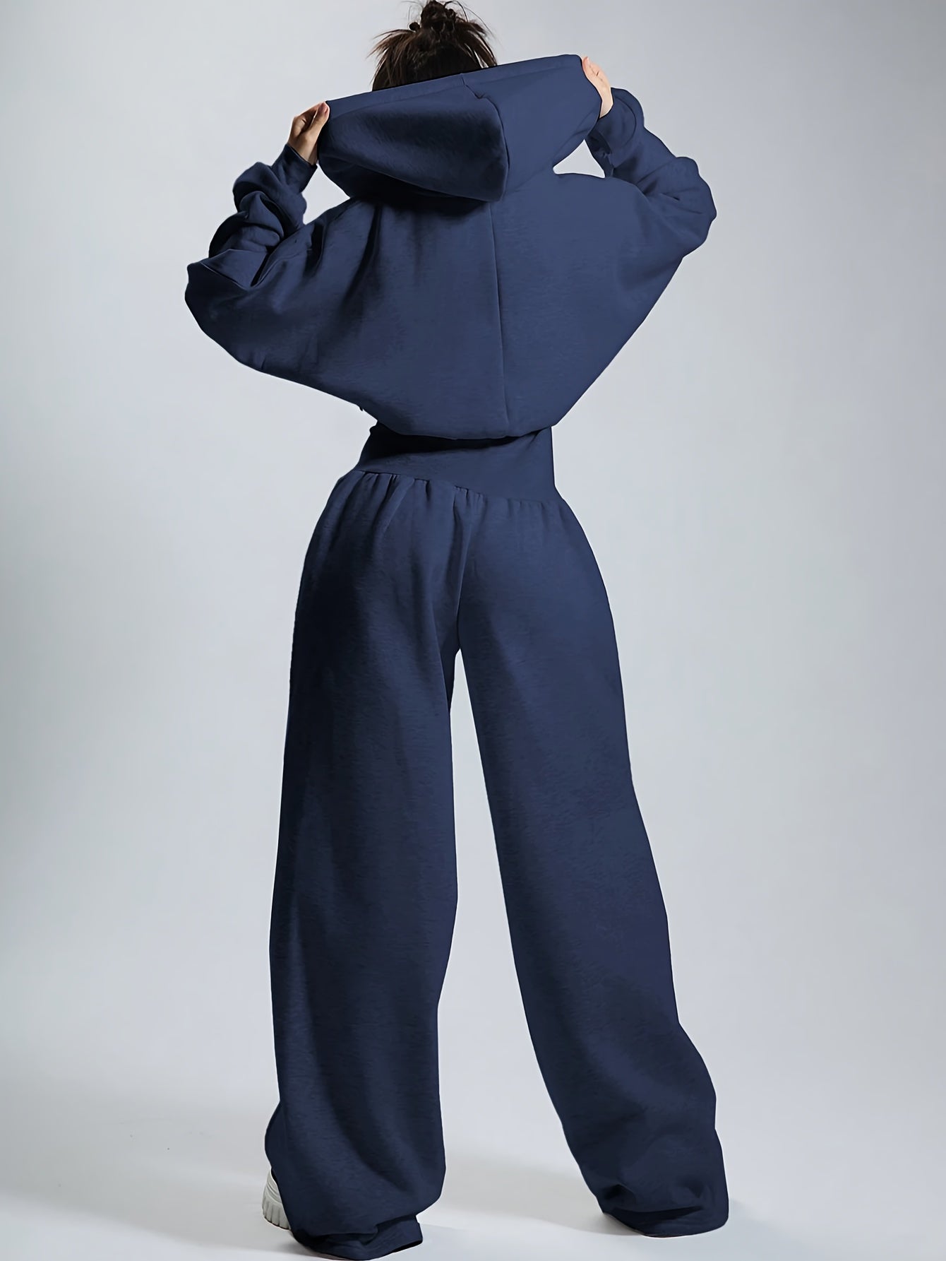 Women's jumpsuit with hood, long sleeves, wide legs, and zipper