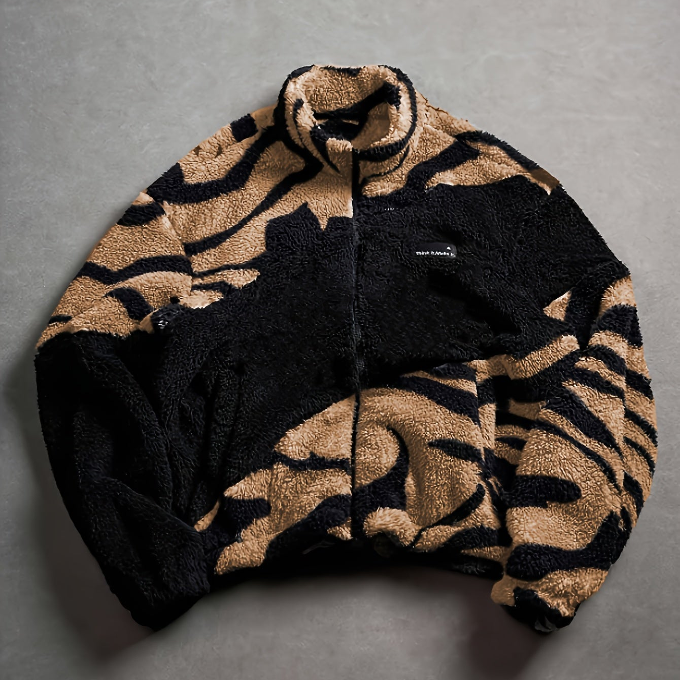 Unisex fleece jacket with stand-up collar, zipper, and animal print