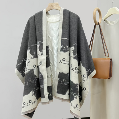 Women's poncho with cat pattern, fringe, and soft fabric