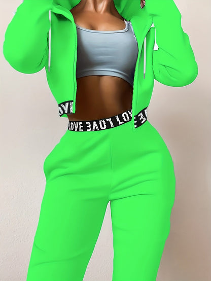 Women's two-piece tracksuit with a hooded jacket and cropped-length joggers featuring a “LOVE” waistband