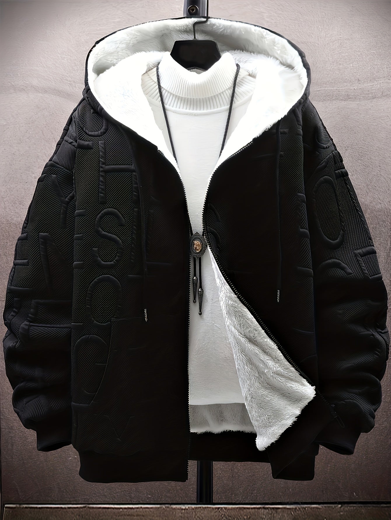 Unisex hooded jacket with fleece lining and raised lettering, zipper, kangaroo pockets, in black