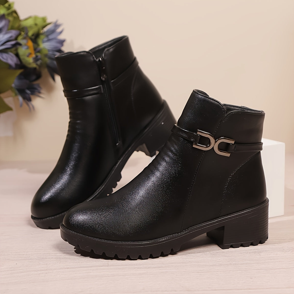 Women's ankle boots with decorative buckle and zip, lug sole, block heel