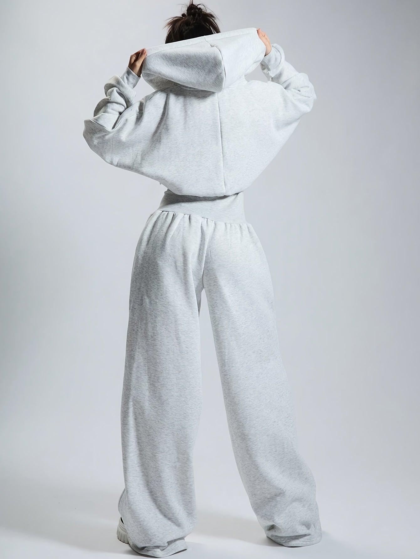 Women's jumpsuit with hood, long sleeves, wide legs, and zipper