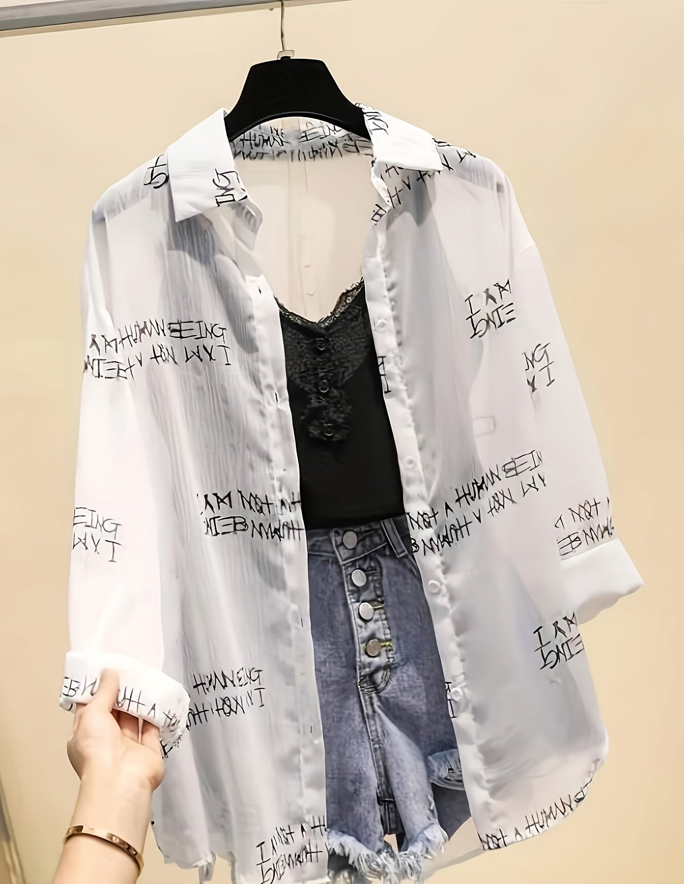 Women's blouse with newspaper print and shorts – fashionable set for leisure and everyday wear