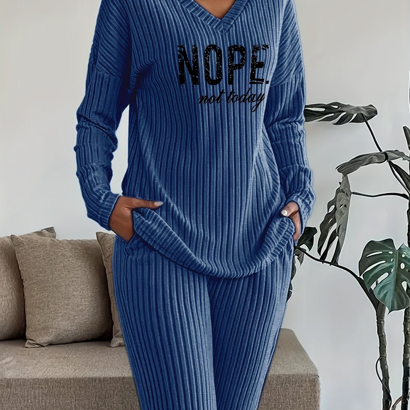 Ribbed women’s two-piece set with a V-neck top featuring lettering and wide-leg pants
