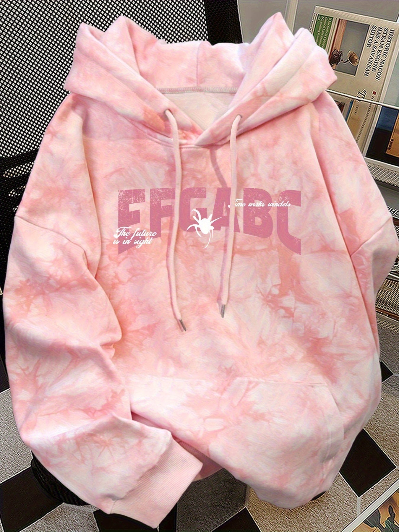 Pink tie-dye hoodie with spider print and hood