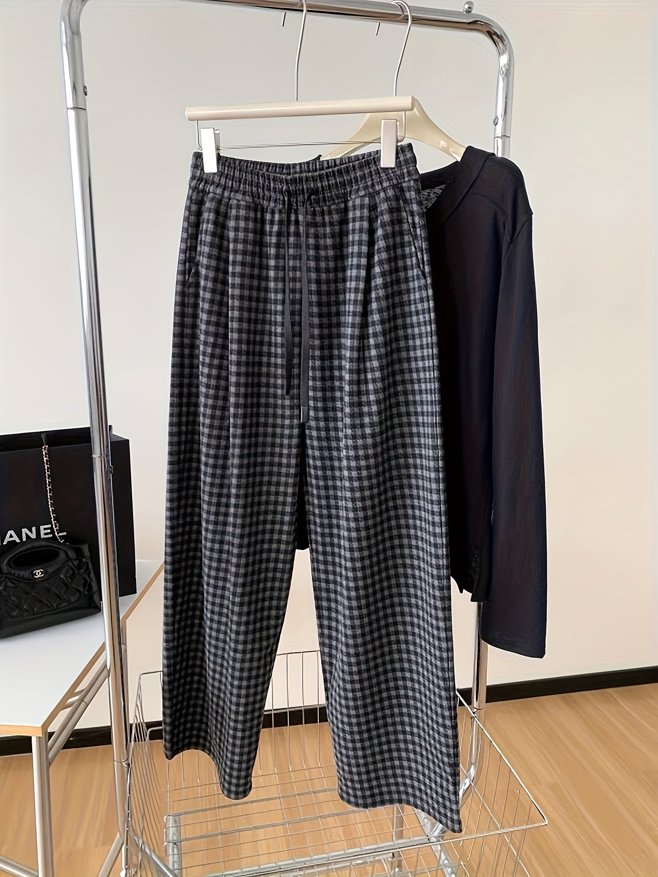 Unisex wide-leg trousers in a gray-and-black gingham pattern