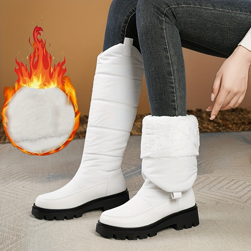 Women's knee-high padded winter boots with lug soles