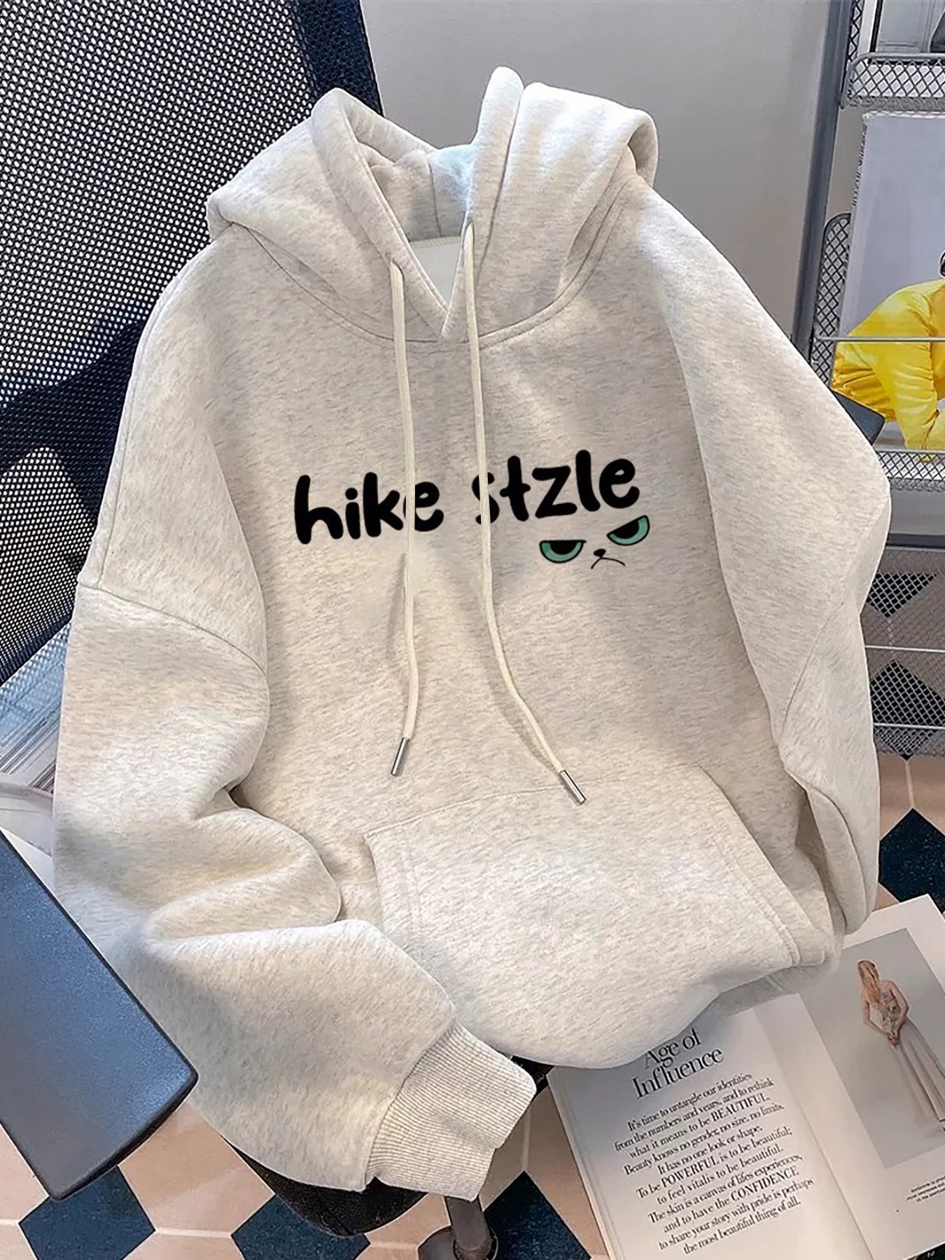 Light gray hoodie with cat print and ears on the hood