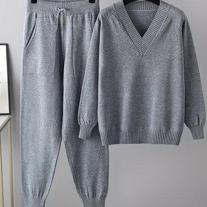 Two-piece women’s knitted set with a V-neck sweater and jogger pants in a beige ribbed-knit design