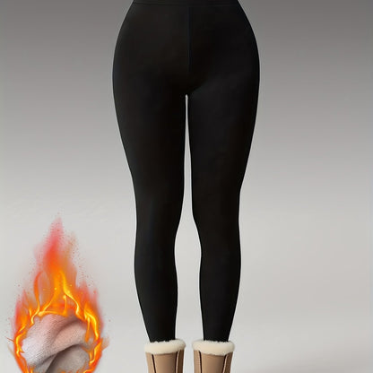 Women's black high-waisted leggings with a thermal look, opaque