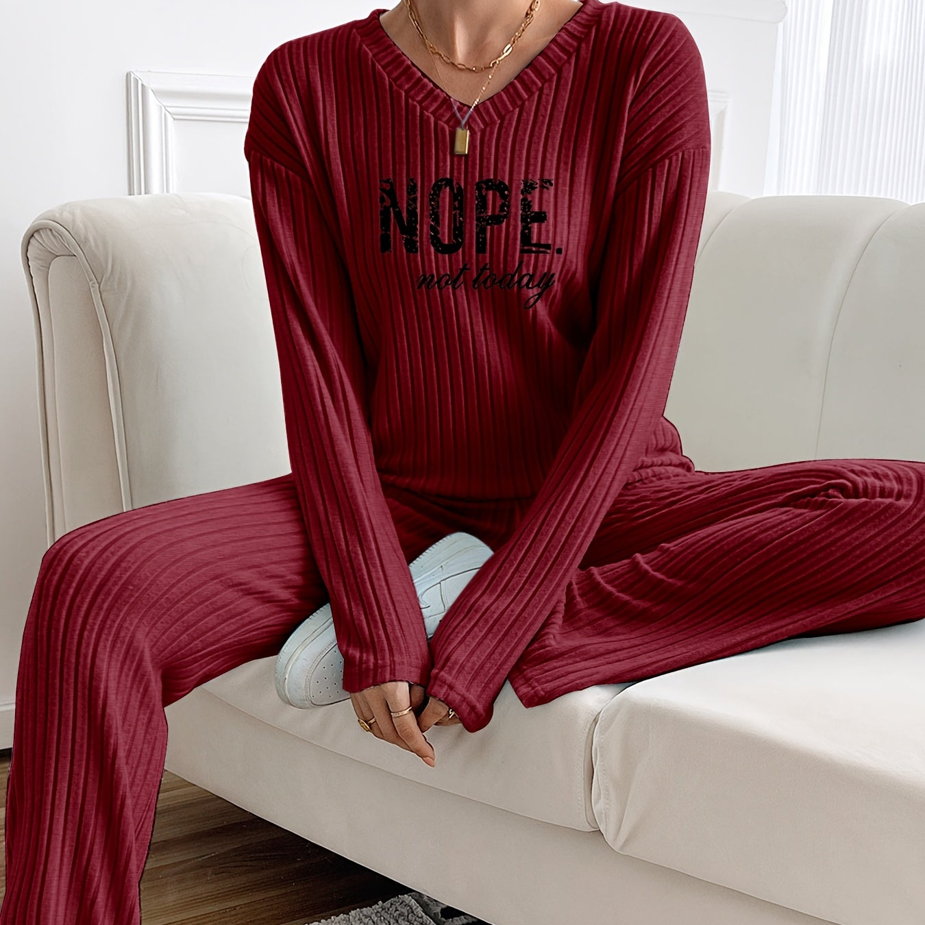 Ribbed women’s two-piece set with a V-neck top featuring lettering and wide-leg pants