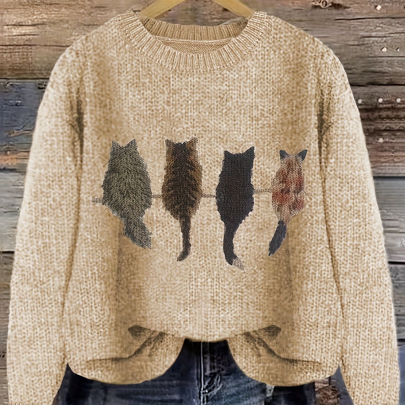 Women's knitted sweater with round neckline and cat motif