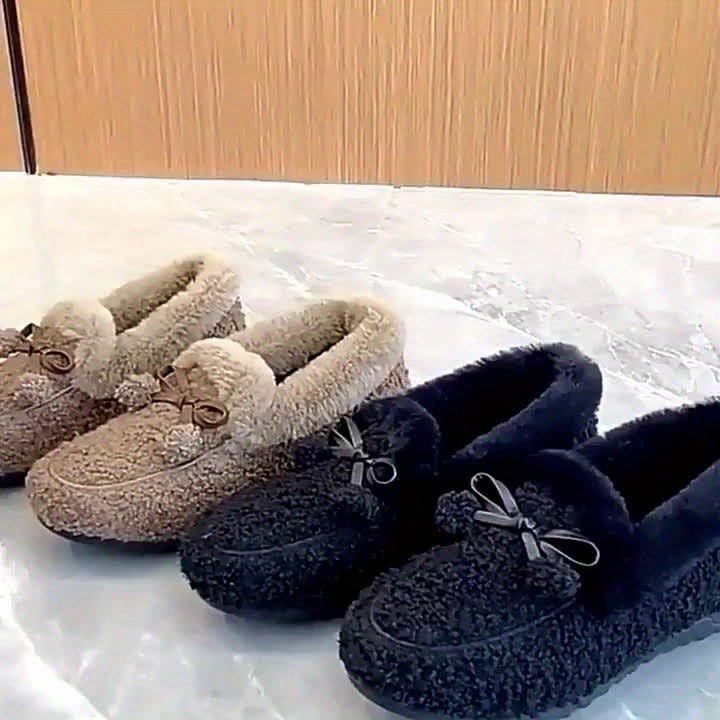 Women's black plush slippers with a bow