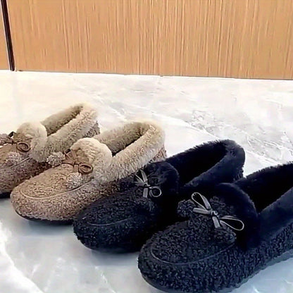 Women's black plush slippers with a bow