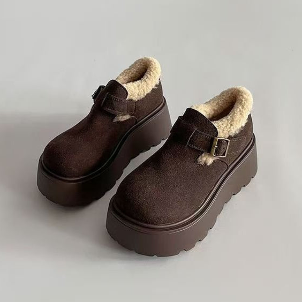 Brown platform moccasins with fur lining and buckle