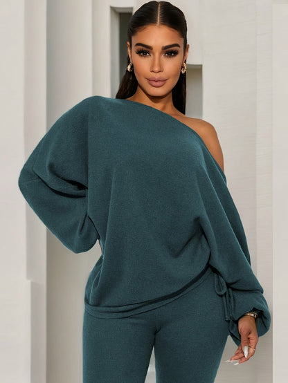 Women's dark green two-piece set with an off-shoulder top and leggings