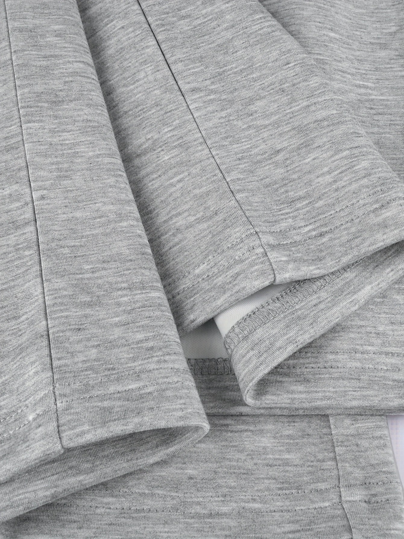 Two-piece women’s sports set: long-sleeve V-neck shirt and wide-leg pants, gray and white