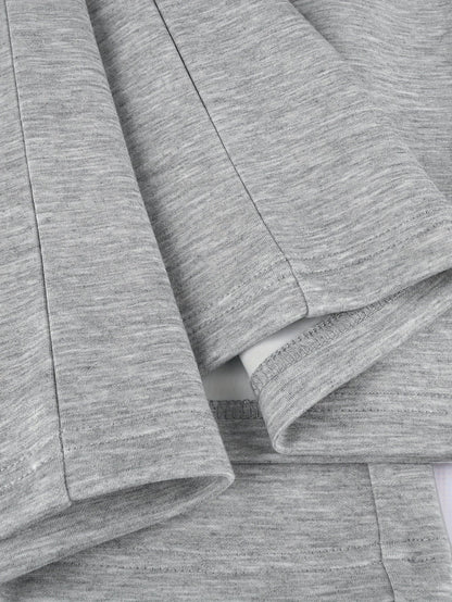 Two-piece women’s sports set: long-sleeve V-neck shirt and wide-leg pants, gray and white