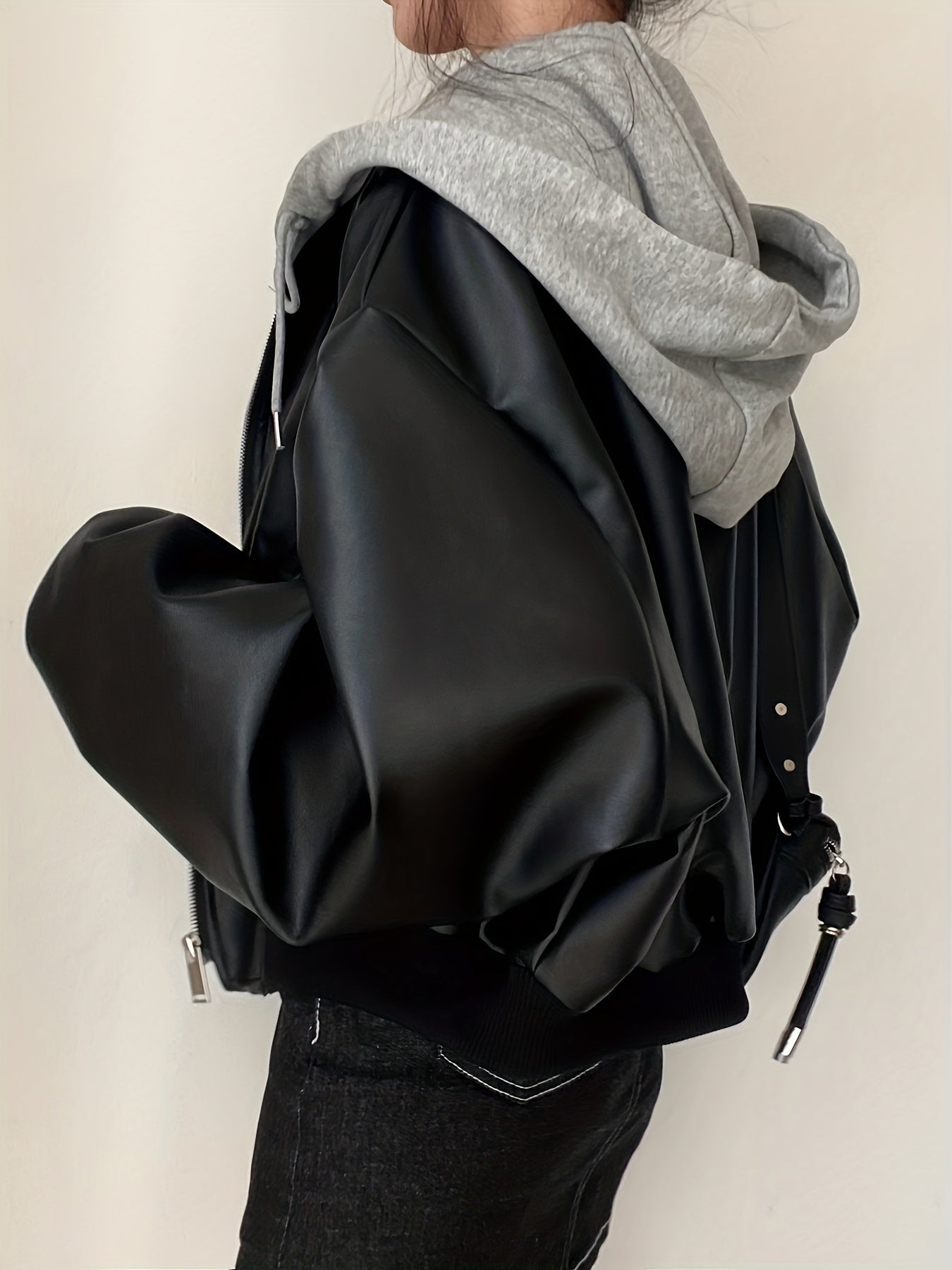 Unisex black bomber jacket with hood made of soft material