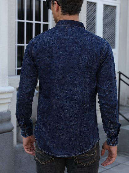 Men's long-sleeve dark blue denim shirt with chest pockets in a worn look
