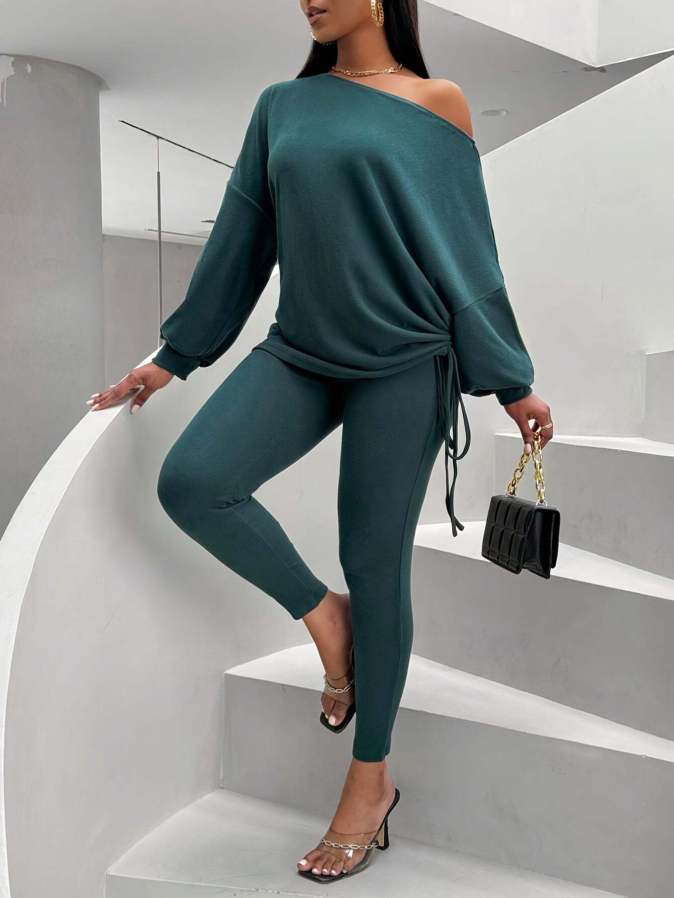 Women's dark green two-piece set with an off-shoulder top and leggings