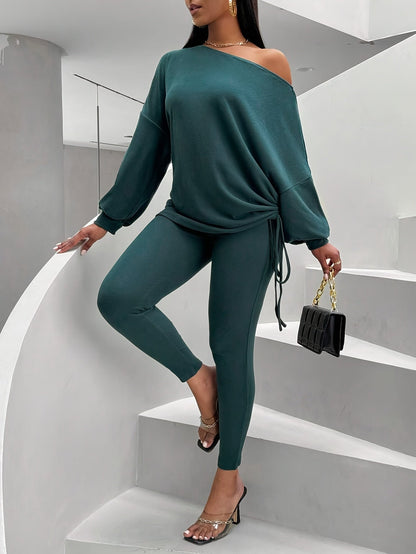 Women's dark green two-piece set with an off-shoulder top and leggings
