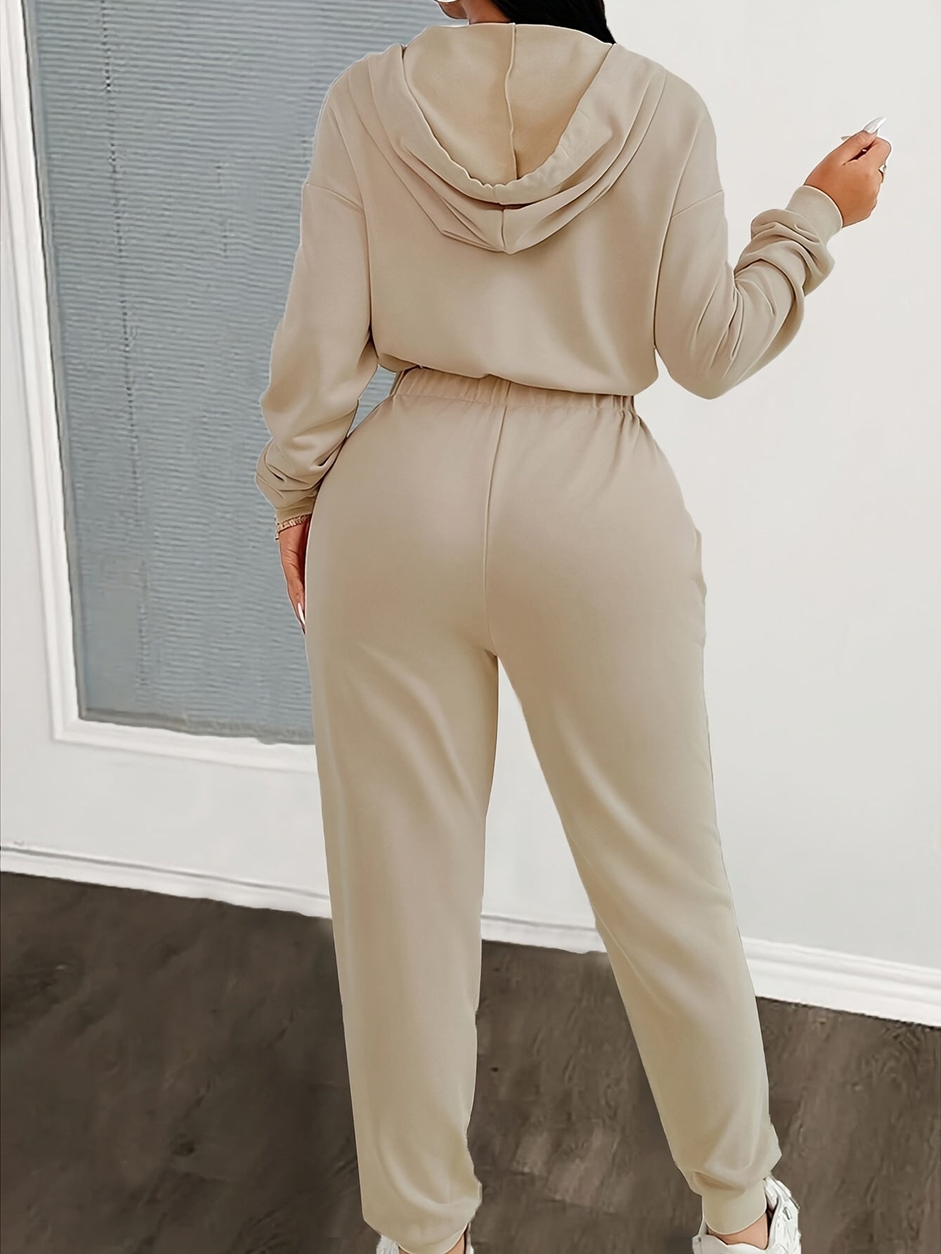 Women's jumpsuit with hood, zipper, and elastic waist