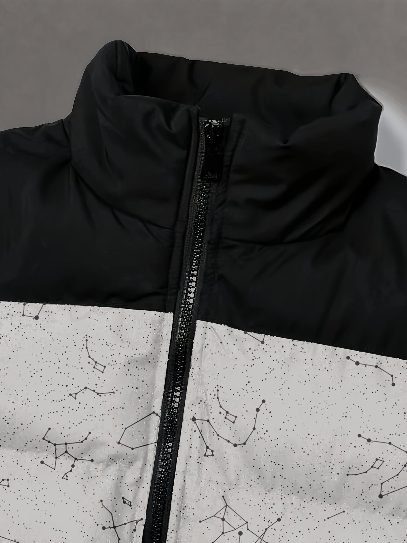Padded jacket with constellation print, zipper, and stand-up collar